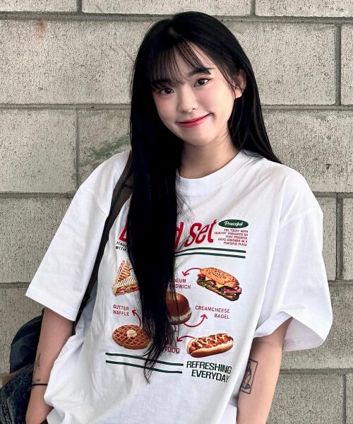 A female model wearing Bread Set Graphic T-Shirt by TRIPCHION available on MUSINSA