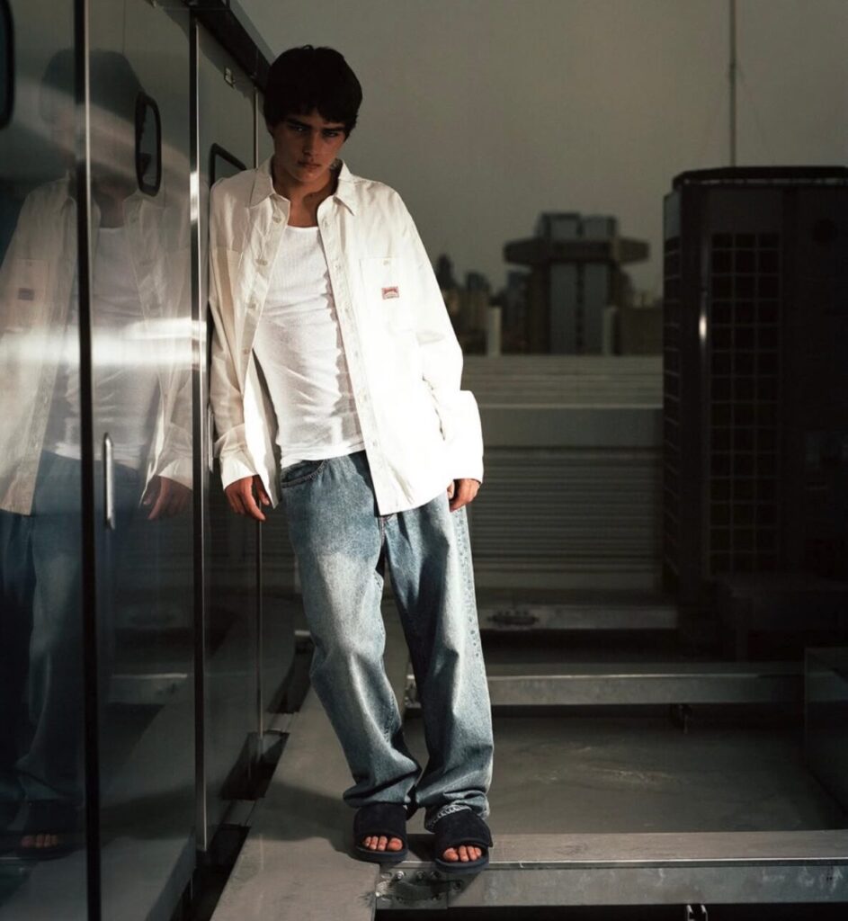a male model wearing thisisneverthat x SUICOKE black slides