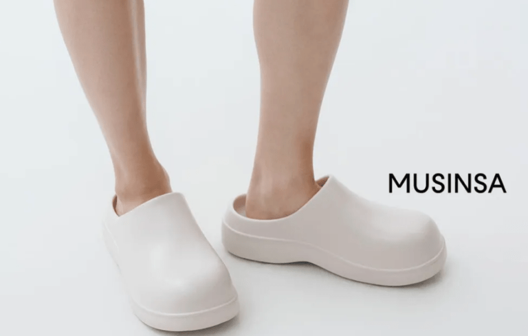A male model wearing MUSINSA STANDARD Chunky Recovery Clog Cream Color