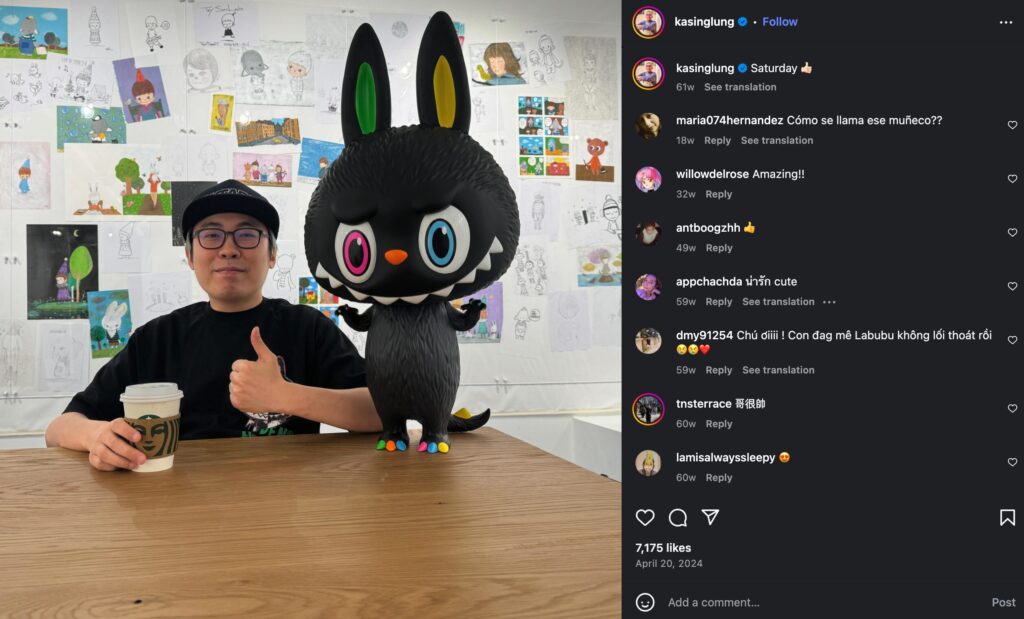 Labubu creator, Kasing Lung, and a huge black Labubu figure